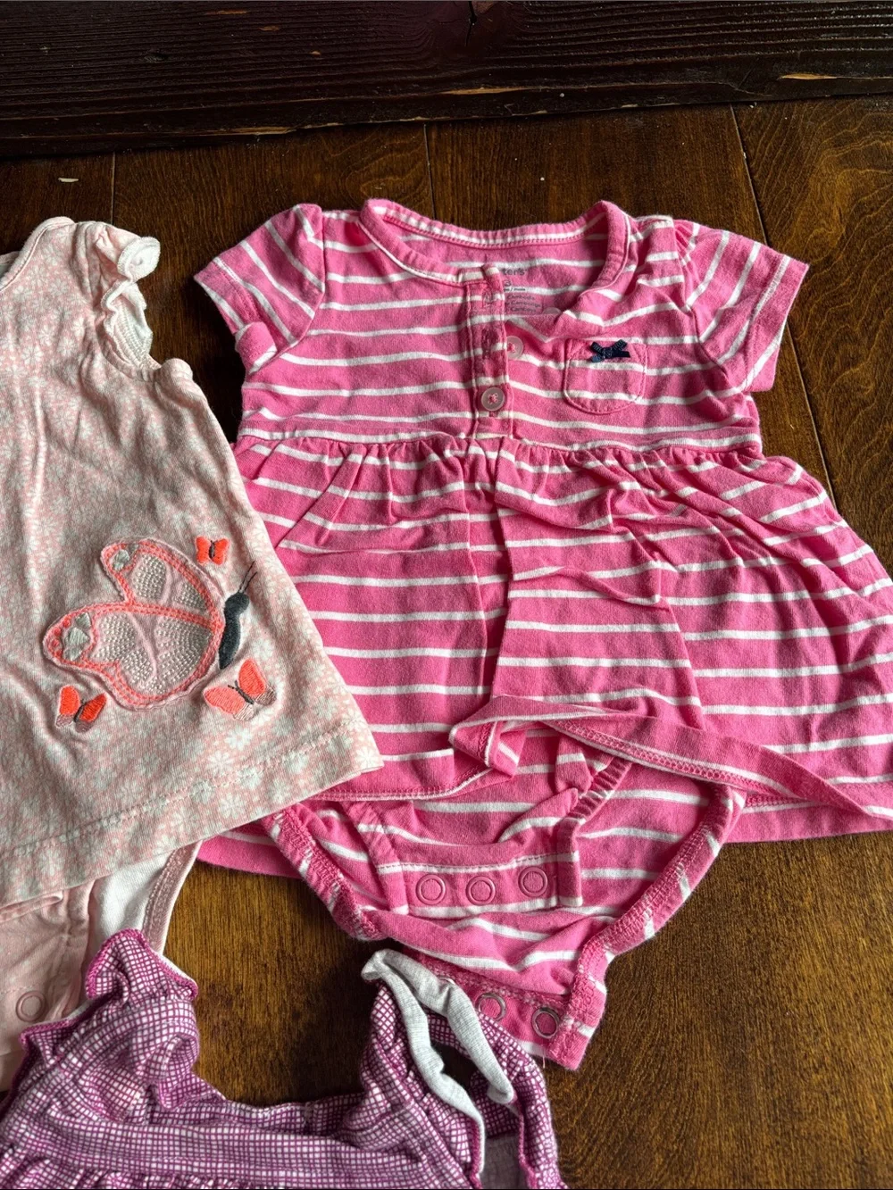 6 tops and 3 rompers with various designs